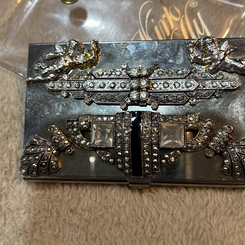 Kirks Folly a gem of a card holder Encrusted w/ stones & 2 cupids so charming